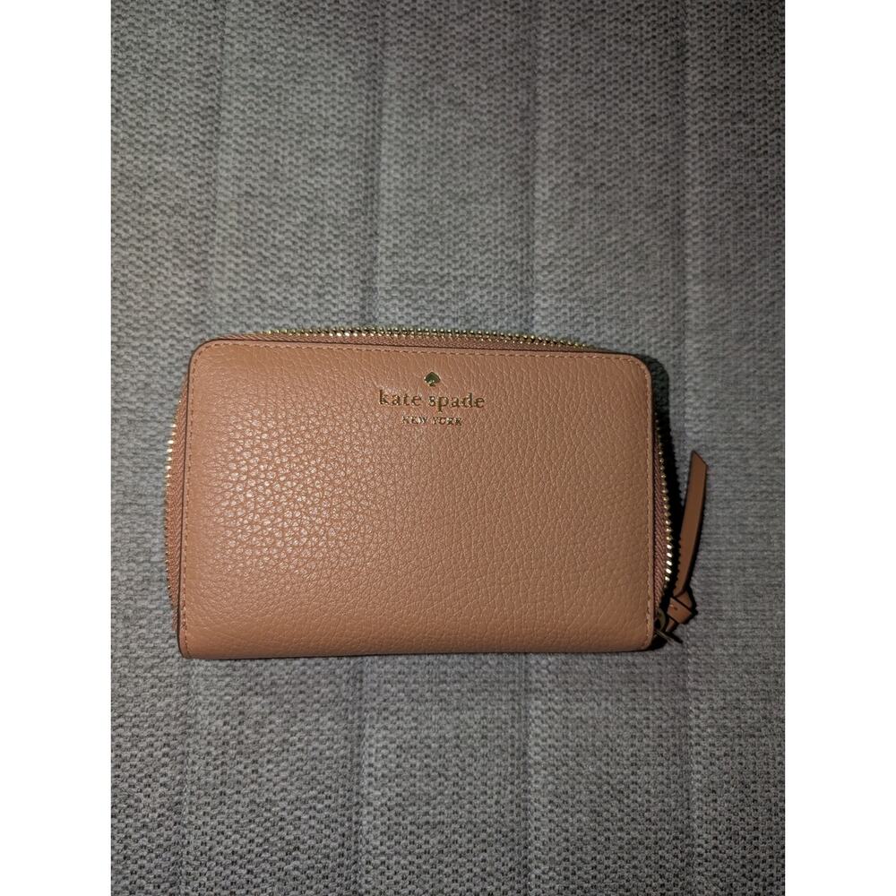 kate spade Pebbled Zip-Around Wallet in Brown